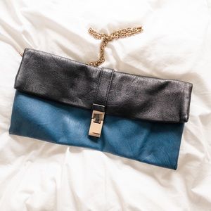 blue and black clutch